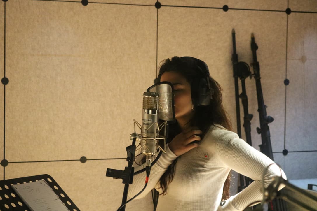 Sofia singing in the studio